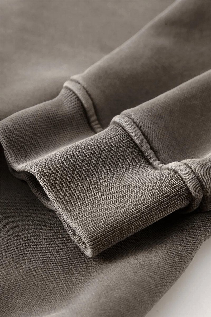 Close-up of a brown fleece sleeve with ribbed cuff, showcasing the texture of the Fashionable Fleece Short Women's Hoodie with Zipper.