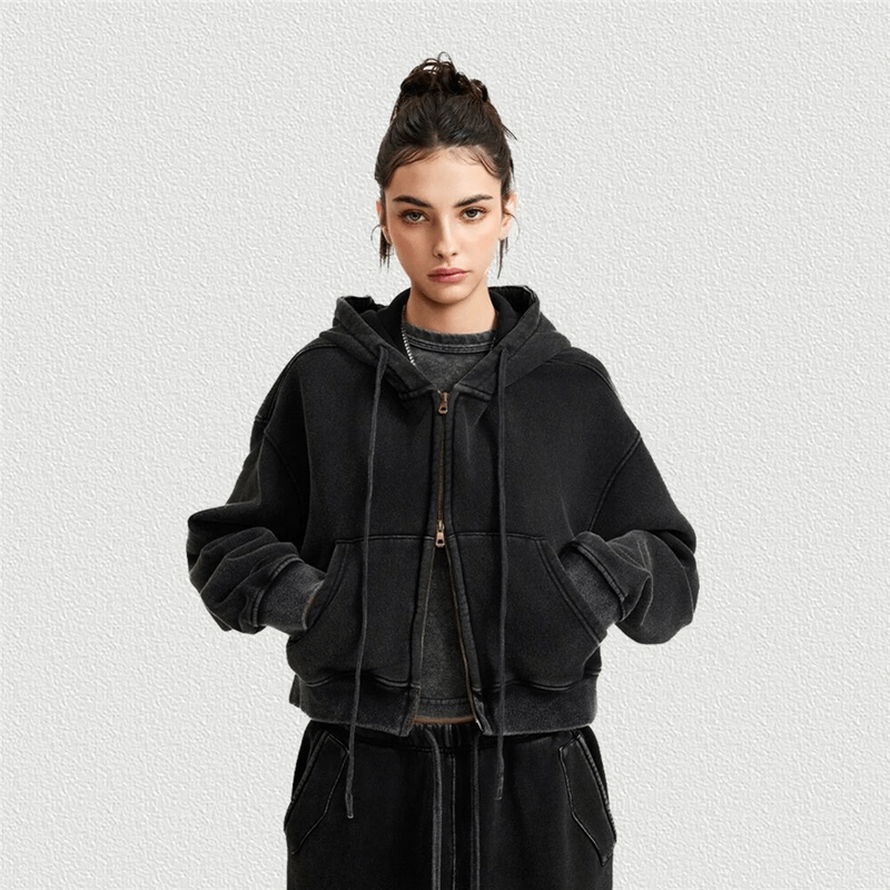 Model wearing a fashionable fleece women's hoodie with zipper, short design, and distressed details, perfect for stylish outings.