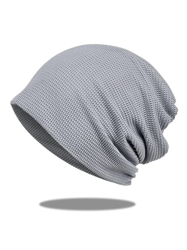 Stylish grey mesh unisex beanie, breathable and quick-drying, offers comfort and SPF 50+ protection, made from polyester.
