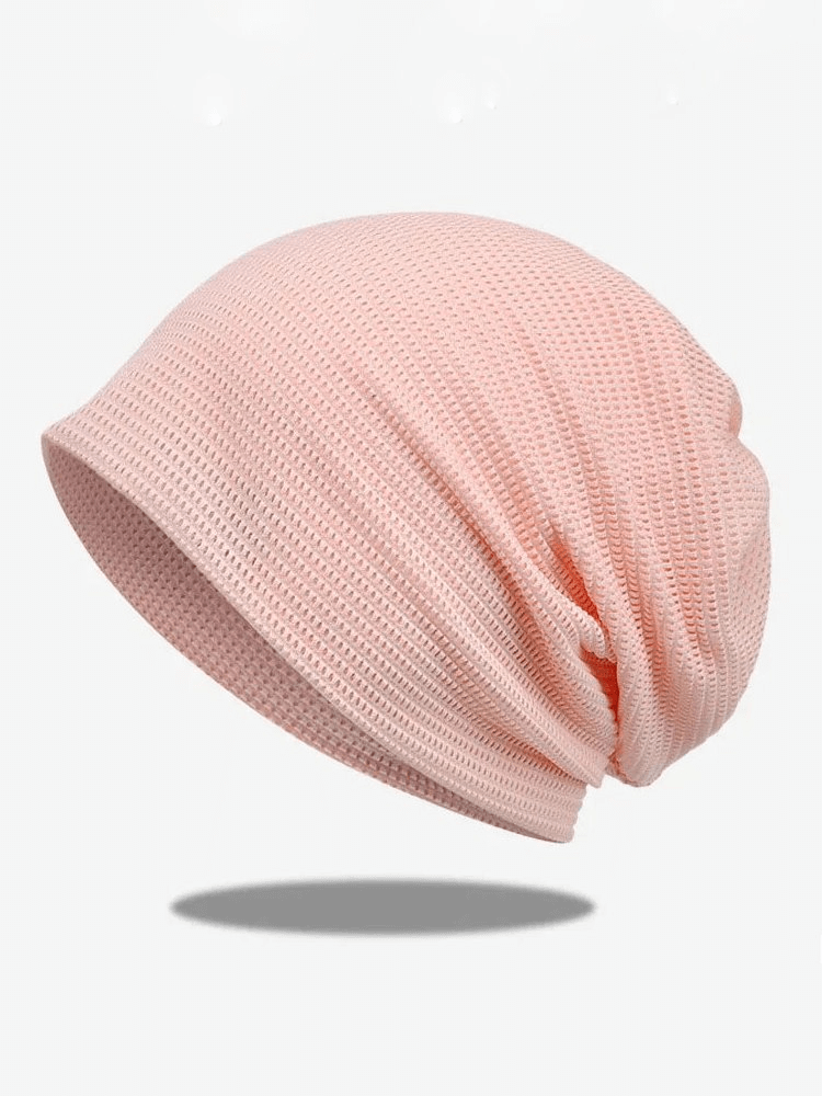 Lightweight pink mesh beanie for sun protection, perfect for fashion and function.