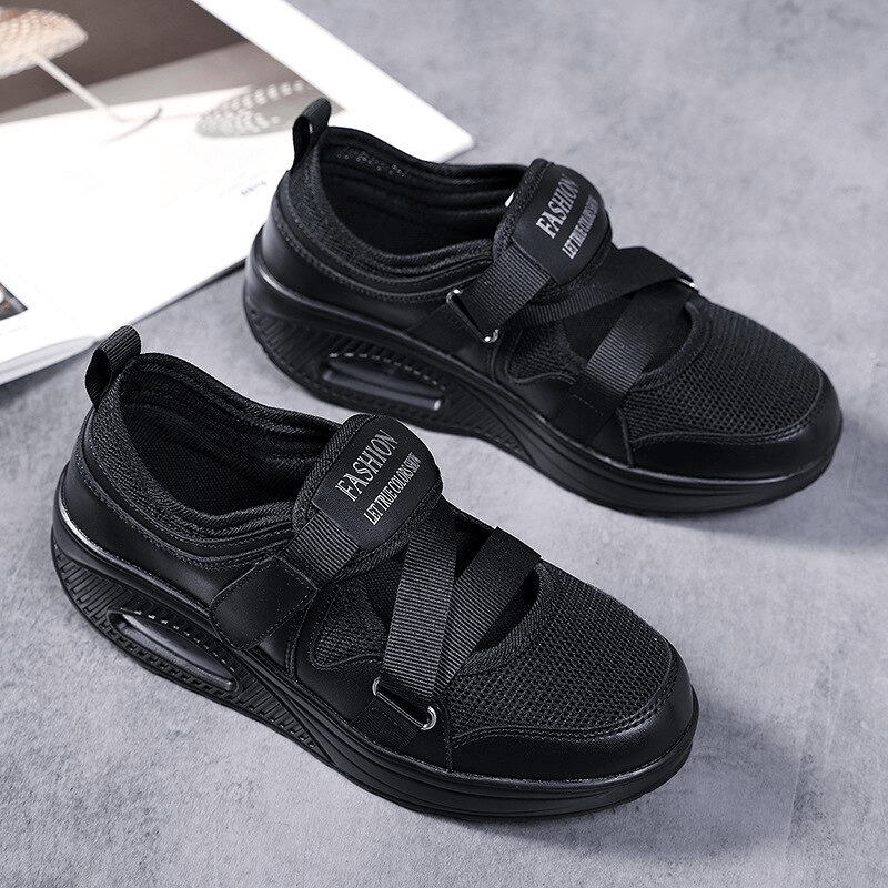 Stylish black women's mesh sneakers with platform sole, featuring a breathable design and comfortable cushioning, perfect for all-day wear.