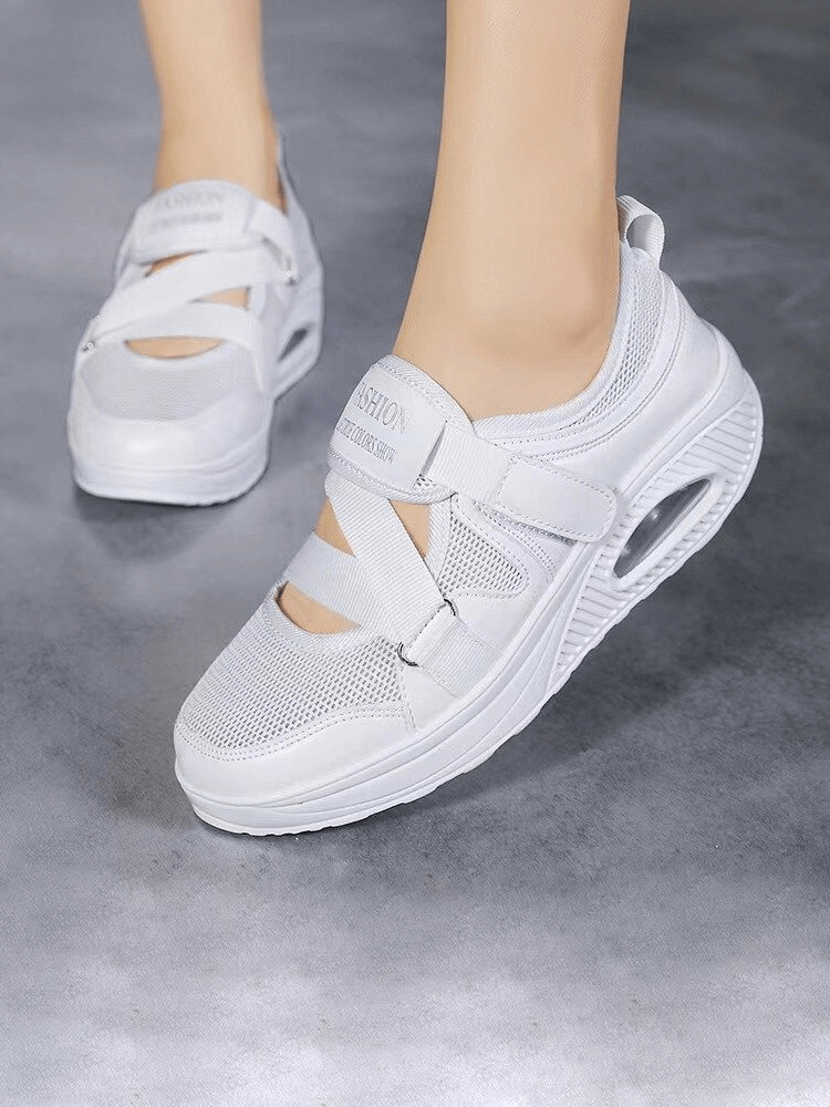 Fashionable women's sneakers SF1540 with white mesh upper, platform sole, and hollow design for style and comfort.