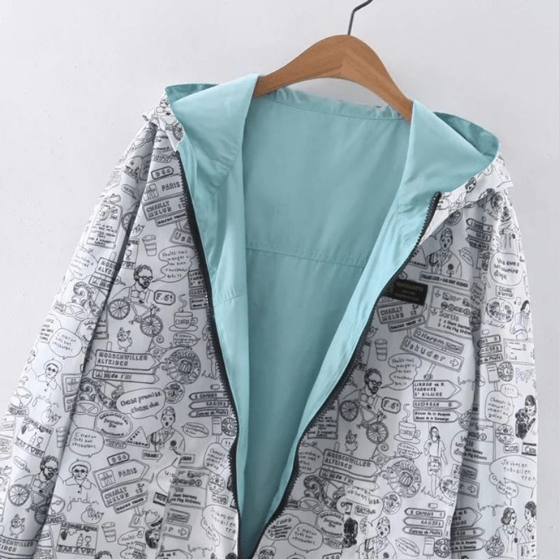 Stylish two-sided breathable women's windbreaker with hood featuring unique print and blue interior, perfect for fashion-forward comfort.