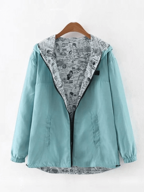 Stylish two-sided windbreaker for women with hood, featuring breathable fabric in aqua and patterned interior for versatile wear.