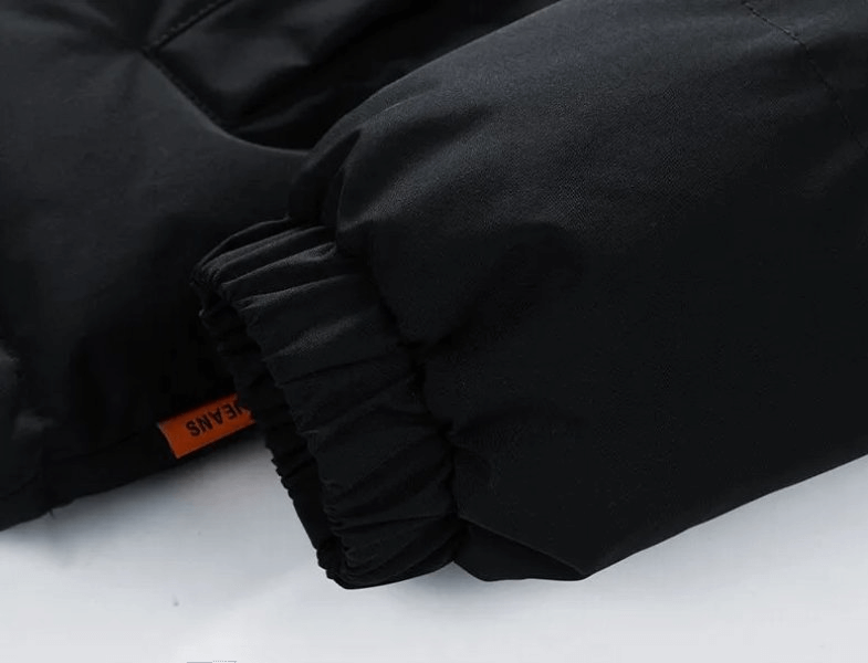 Close-up of a black unisex hooded down jacket sleeve with elastic cuff, showcasing stylish warmth and comfort.