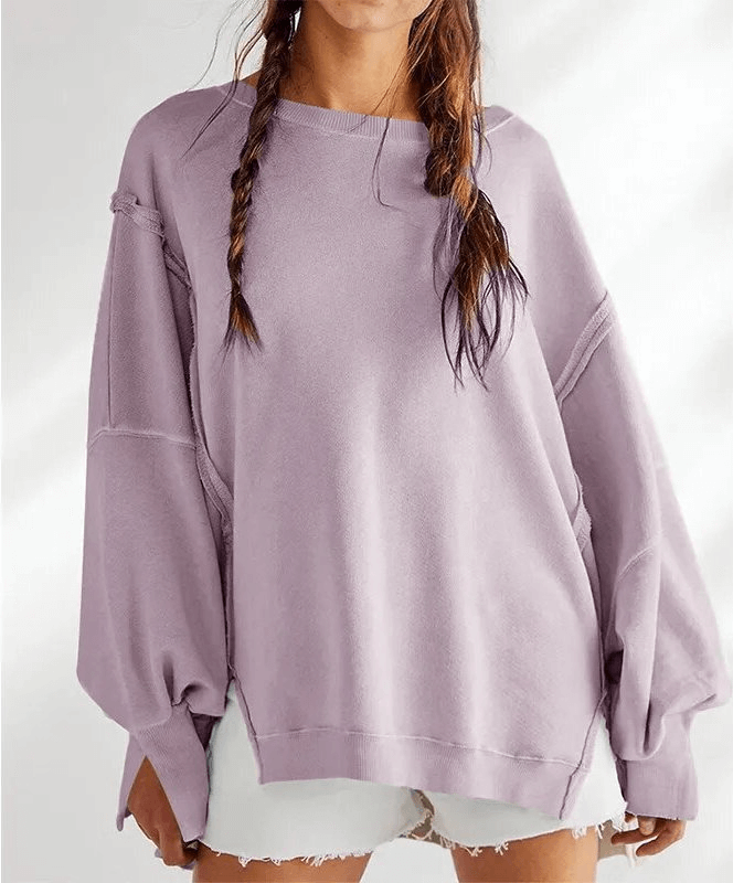 Oversized women's sweatshirt with reversible seam in lavender, featuring an O-neck collar and loose fit for comfortable style.