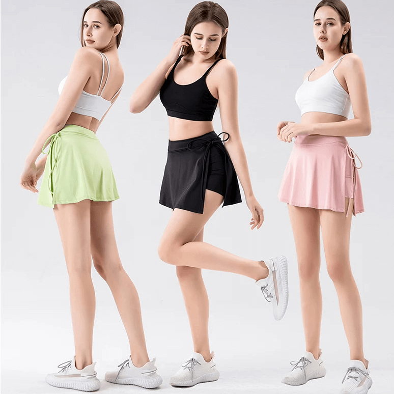 Women modeling Feather-Light Tennis Skirt-Shorts with Pocket in green, black, and pink for sports like badminton, golf, and yoga.