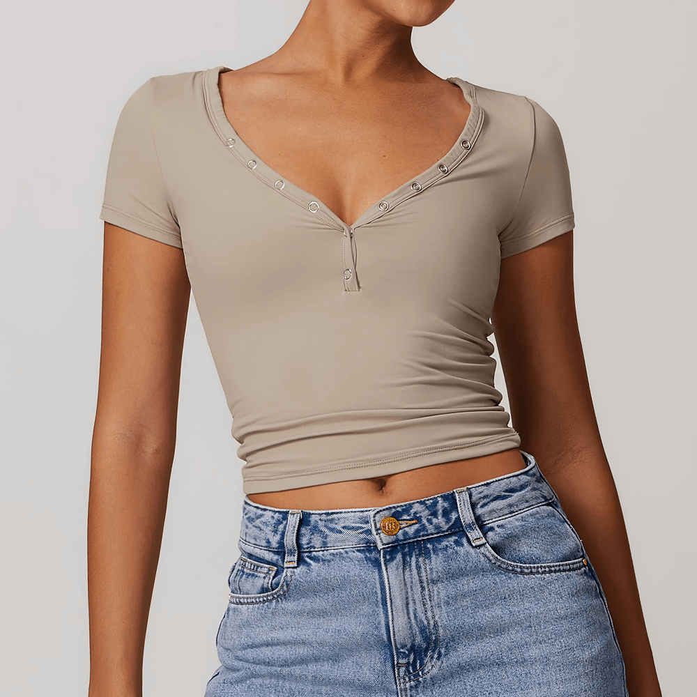 Women wearing a stylish black V-neck short sleeve yoga top with buttons, perfect for fitness and workouts.