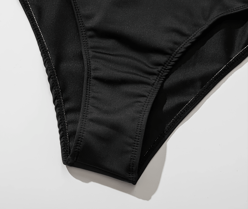 Close-up of the black bottom portion of the Female Cross Front Mesh Tape One Piece Swimsuit - SF4648, showcasing sleek design.