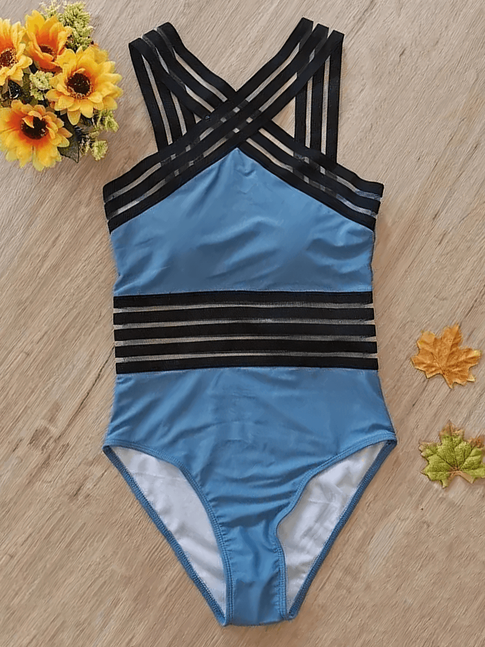 Female Cross Front Mesh Tape One Piece Swimsuit - SF4648 in blue with black mesh tape details and floral decor.