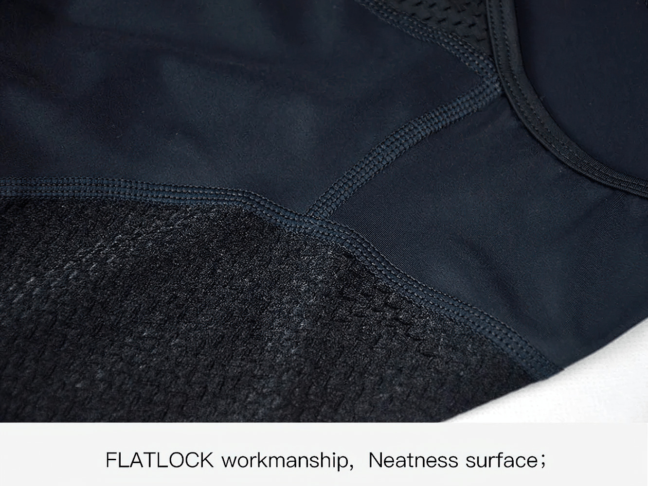 Close-up of female cycling bib shorts in black, highlighting the flatlock workmanship and neat surface finish for comfort.