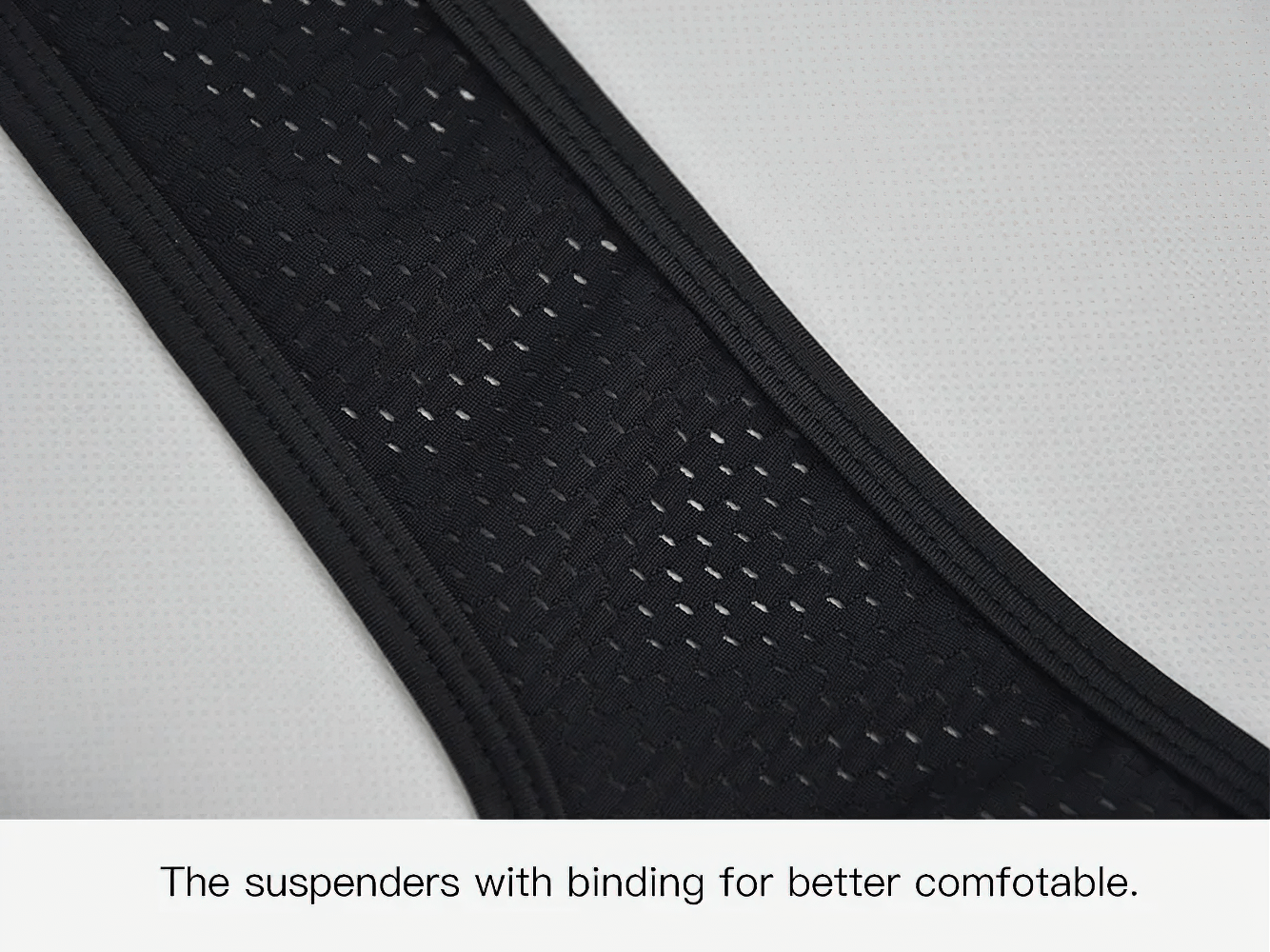 Close-up of black breathable suspenders on women's cycling bib shorts for enhanced comfort and flexibility.