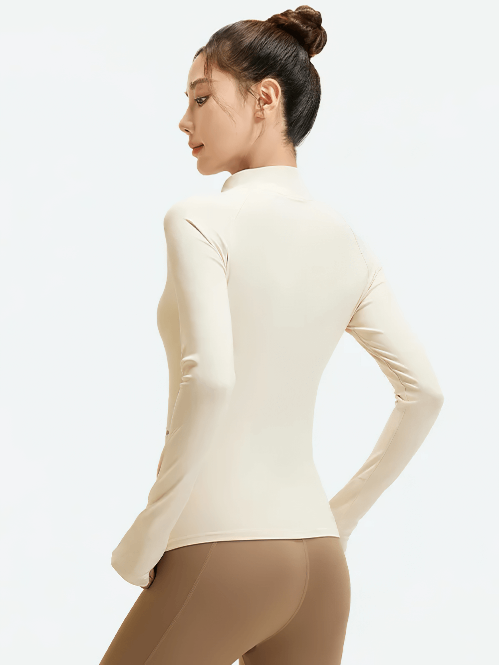 Woman wearing Female Full-Zip Sport Jacket with Thumbholes - SF4049, showcasing back view with turtleneck collar and sleek design.