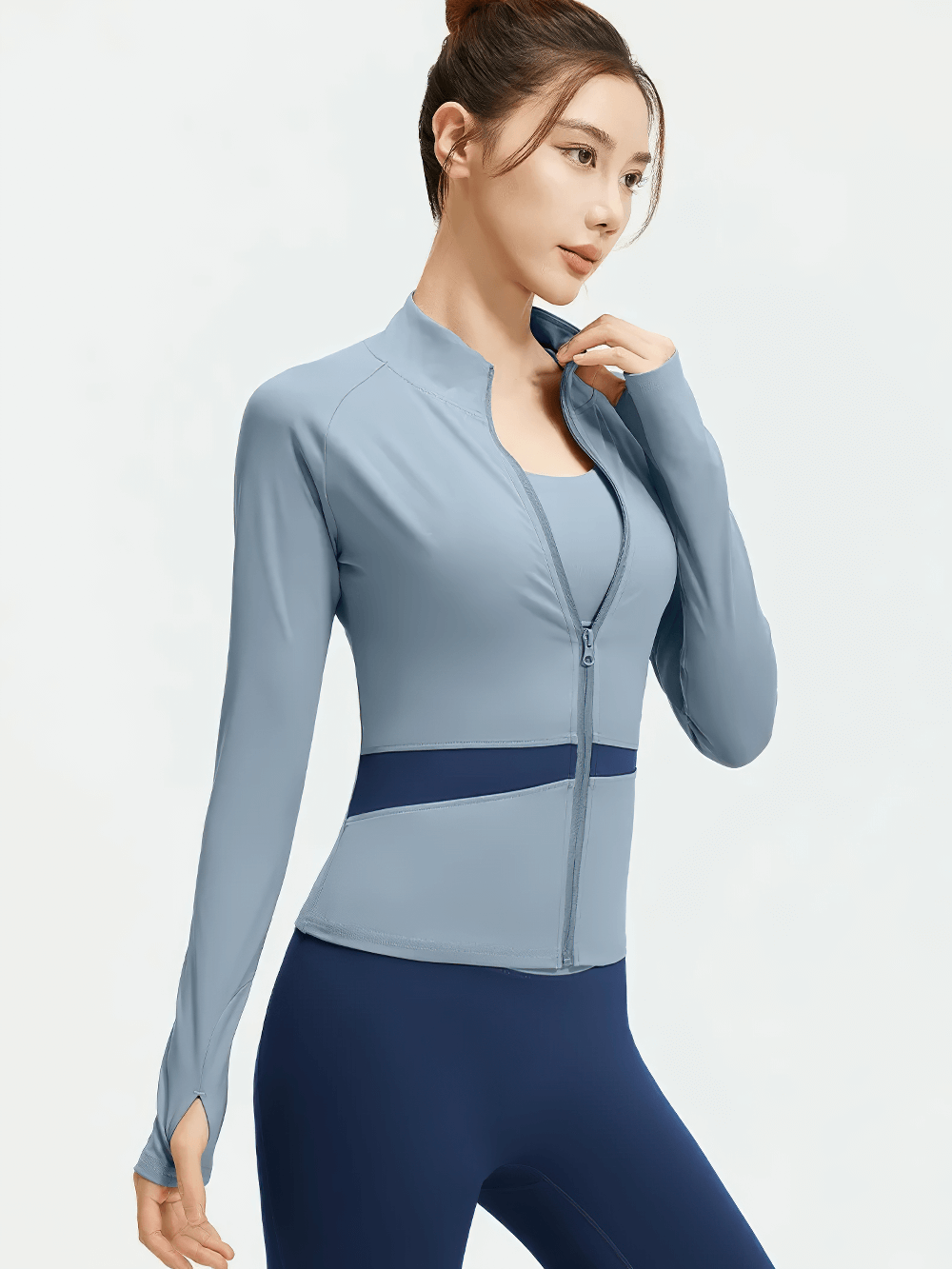 Woman wearing Female Full-Zip Sport Jacket with Thumbholes - SF4049, showcasing sleek design and color-block waist panel.