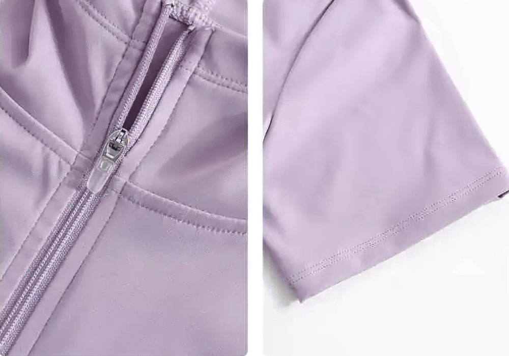 Alt Tag: Female Hooded Short Sleeves Running Zip-Up Jacket - SF4475 close-up of full zip and short sleeve hem in soft lavender quick-dry fabric