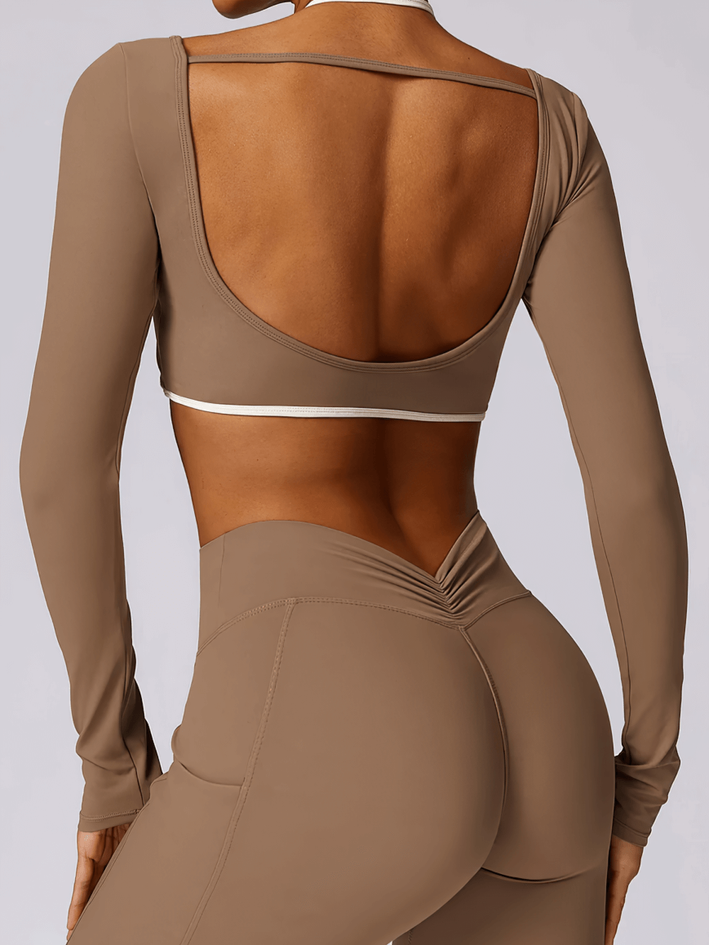Female Long Sleeve Yoga Crop Top with White Straps - SF4200, back view showcasing unique backless design and sporty white straps.