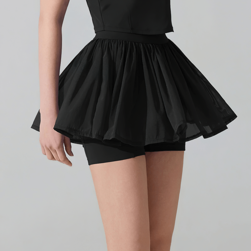 Female Pleated Tennis Skort with Built In Shorts - SF4577 in black, featuring a stylish pleated design and built-in shorts.