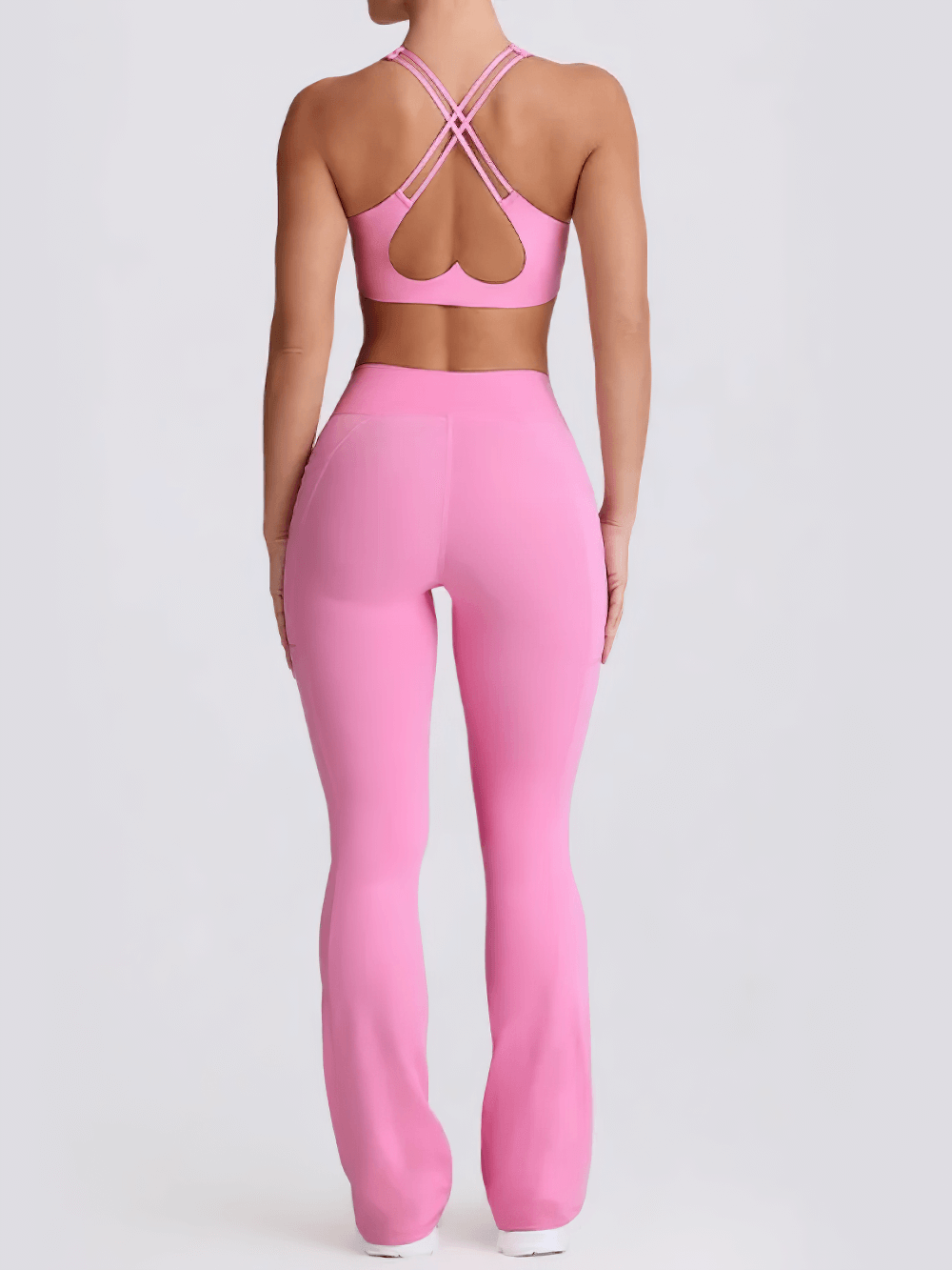 Alt Tag: Female Set of Sports Bra and High Waist Flare Pants - SF4333 pink racerback sports bra with crisscross back and high-waist flare pants