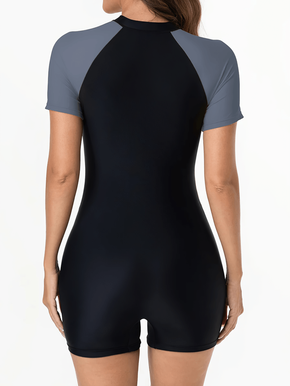 Alt Tag: Female Short Sleeve Surf Zip One Piece Swimsuit - SF4538 back view black one-piece with short sleeves, sporty patchwork panels