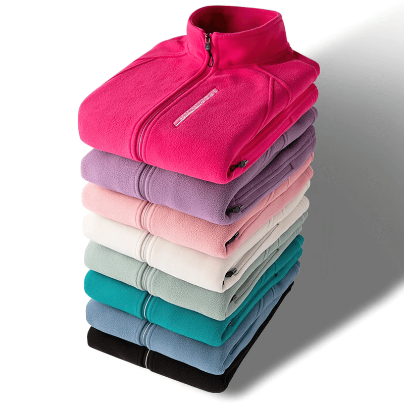 Stack of colorful fleece jackets with stand collars, including pink, purple, and teal, showcasing cozy fabric and zip-up design with pockets.