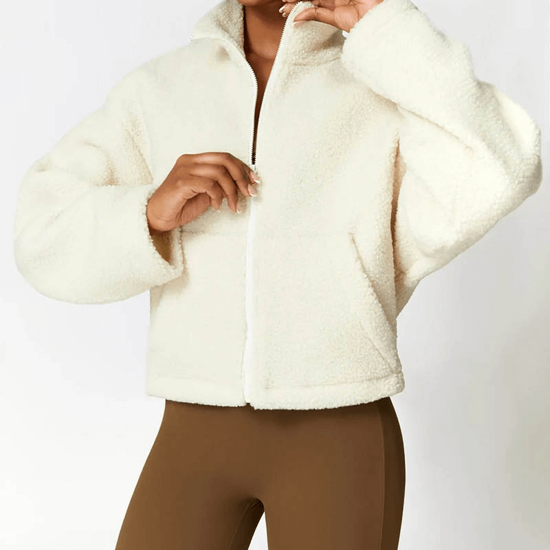 Female wearing a warm, thick fleece jacket with zipper. Perfect for winter, breathable polyester material. Stylish, classic look.