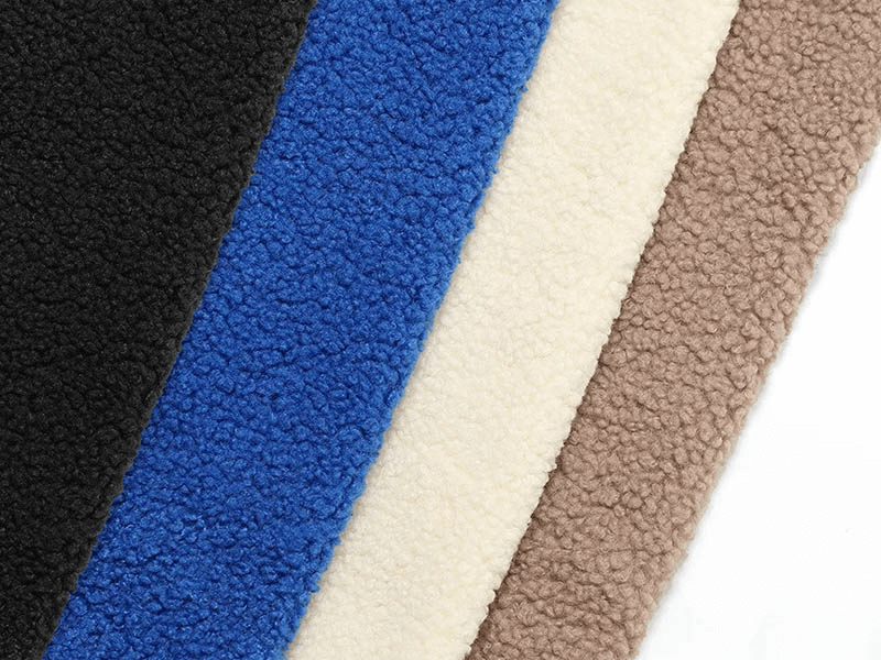Multicolor fleece fabric swatches in black, blue, cream, and brown, showcasing textures for warm winter jackets.