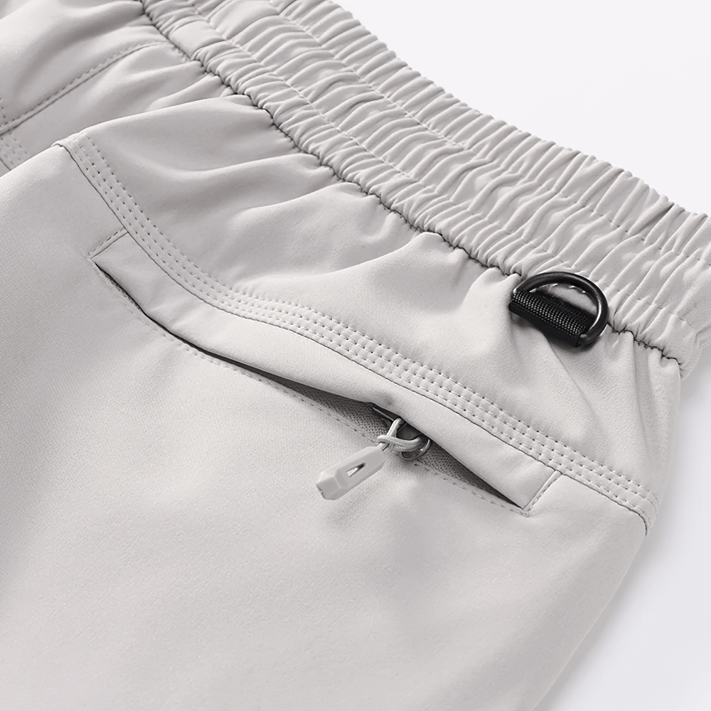 Female Waterproof Hiking Pants with Zip Pockets - SF4397 close-up: elastic waistband, drawstring loop, and zip pocket detail