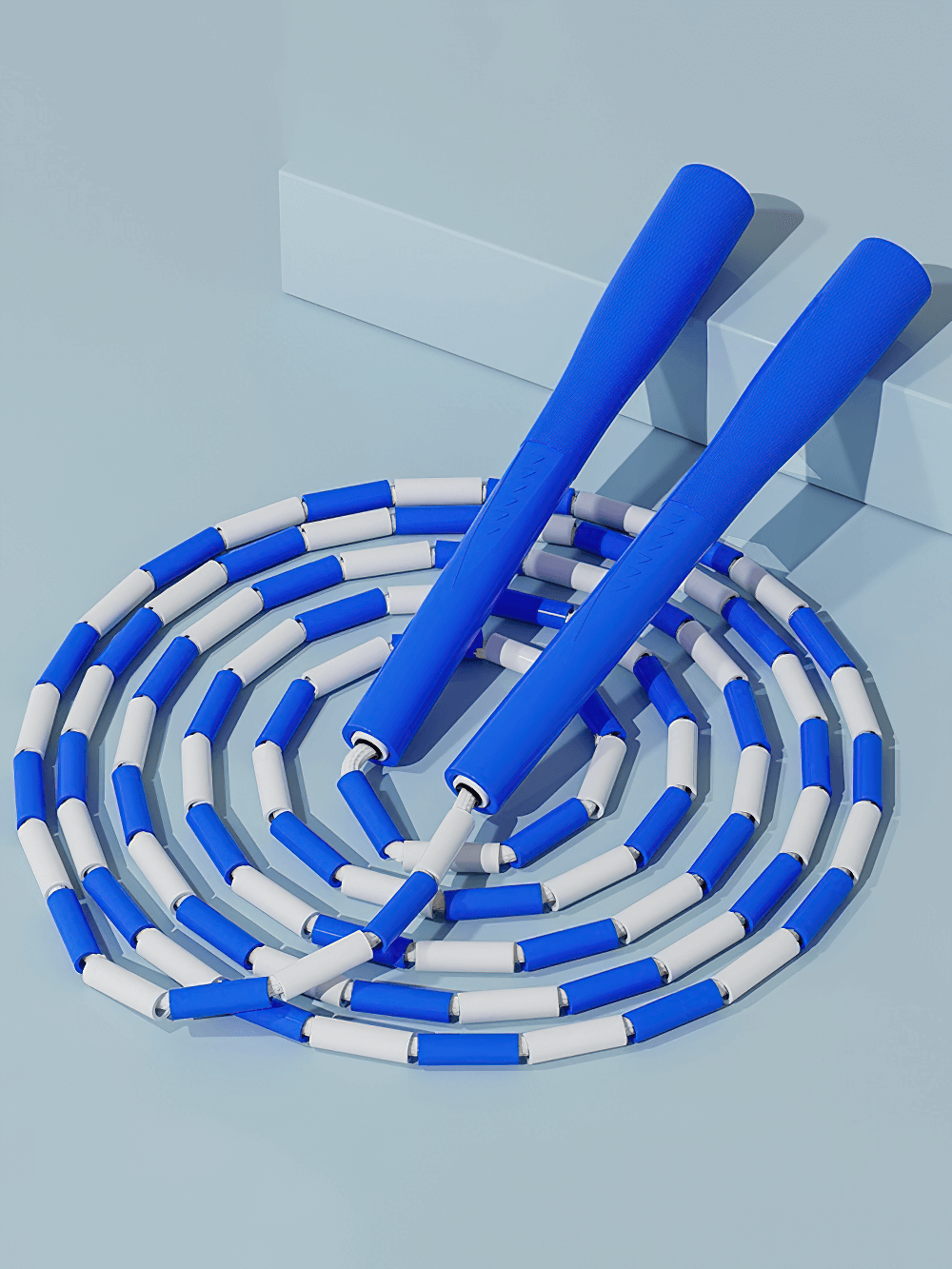 Blue and white fitness beaded jump rope SF2768 coiled on a light blue background, ideal for workouts and exercise routines.