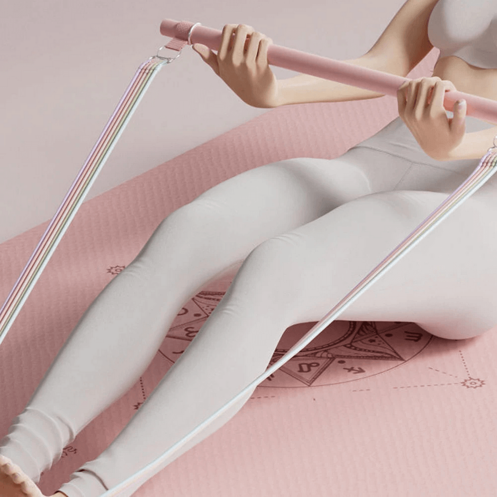 Woman using Fitness Elastic Resistance Band with Handles - SF3430 for home workout on pink mat, showcasing versatility and strength.