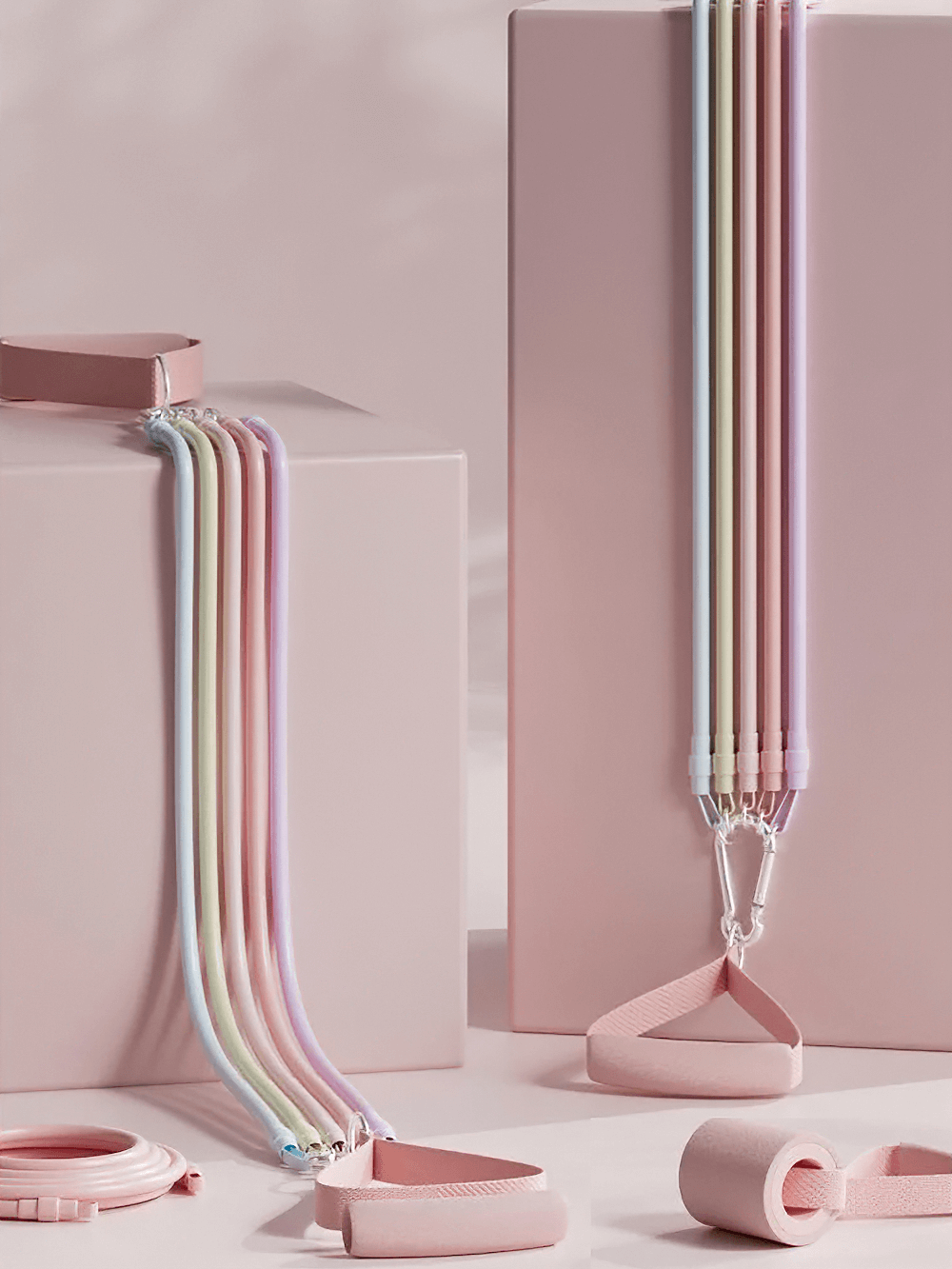 Fitness Elastic Resistance Band with Handles - SF3430 for versatile workouts, shown coiled with grip handles on pink blocks.