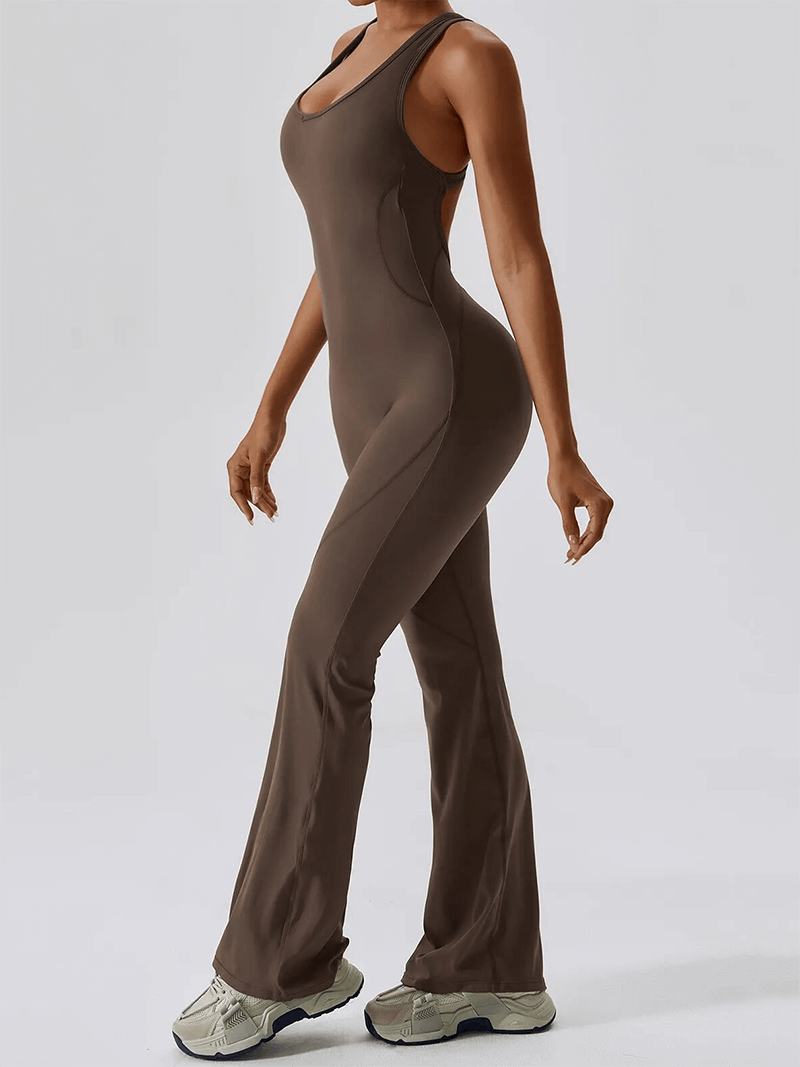 Woman wearing fitness open back compressed jumpsuit for women SF1597, ideal for yoga, running, and gym fitness, in brown color.