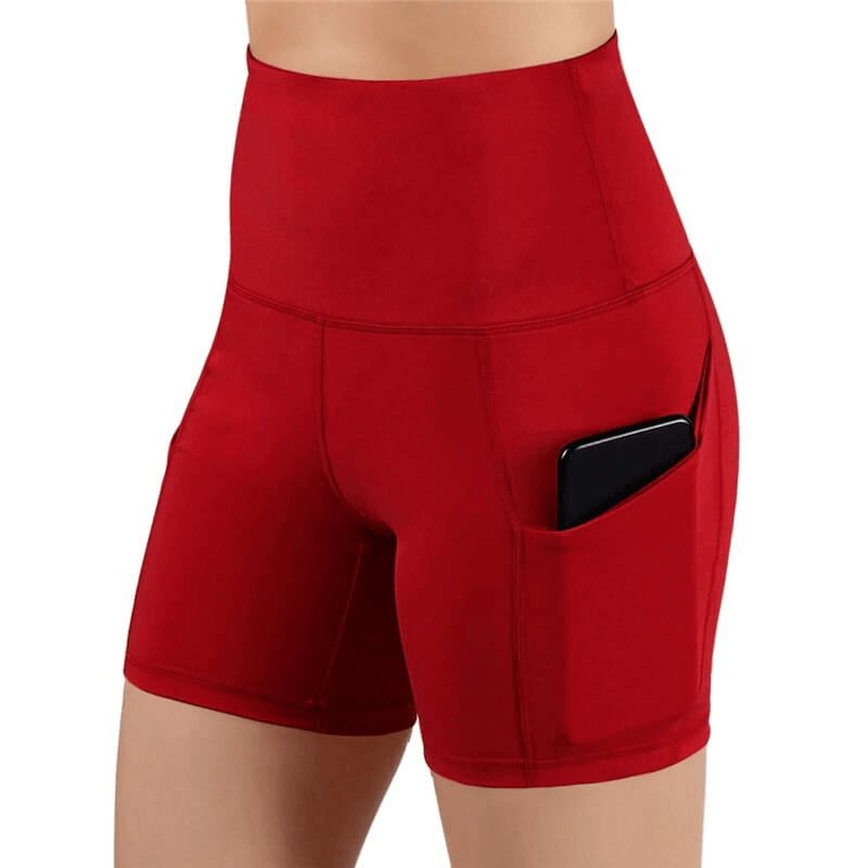 High-waisted red women's fitness shorts with phone pocket, showcasing stretchy fit and functionality for active lifestyles.