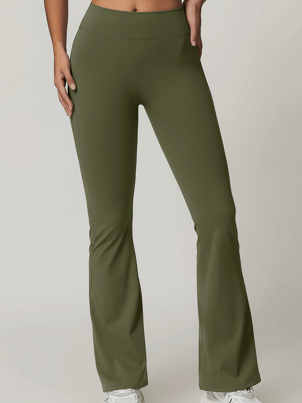 Flare yoga pants with a pocket and scrunch design in olive green, featuring a high waist and bell-bottom style for a trendy workout look.