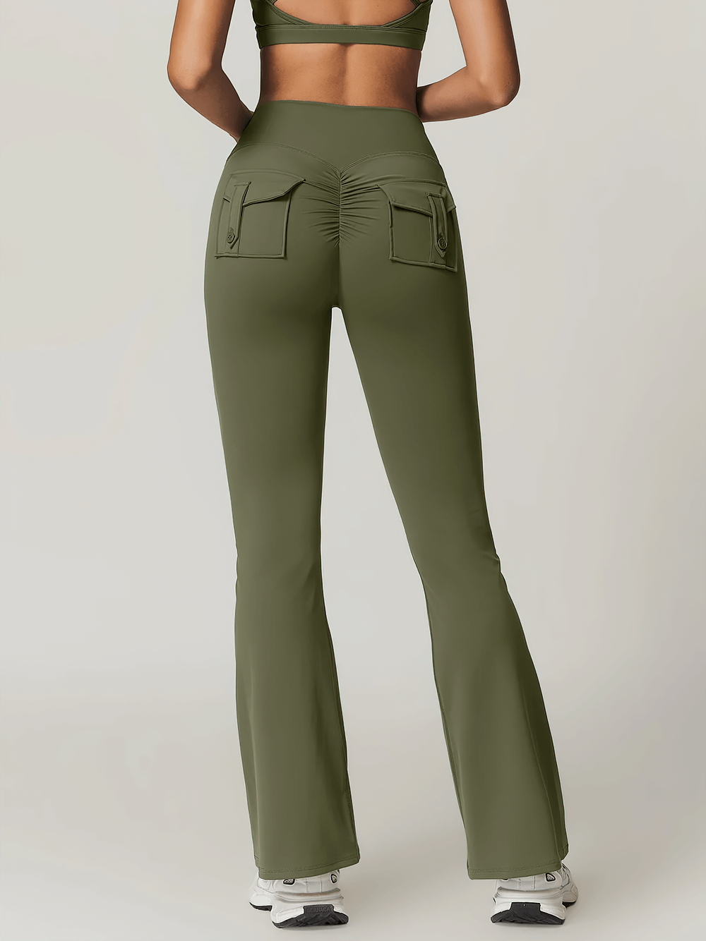 Back view of olive green flare yoga pants with scrunch design, high waist, and pocket. Ideal for workouts and casual wear.