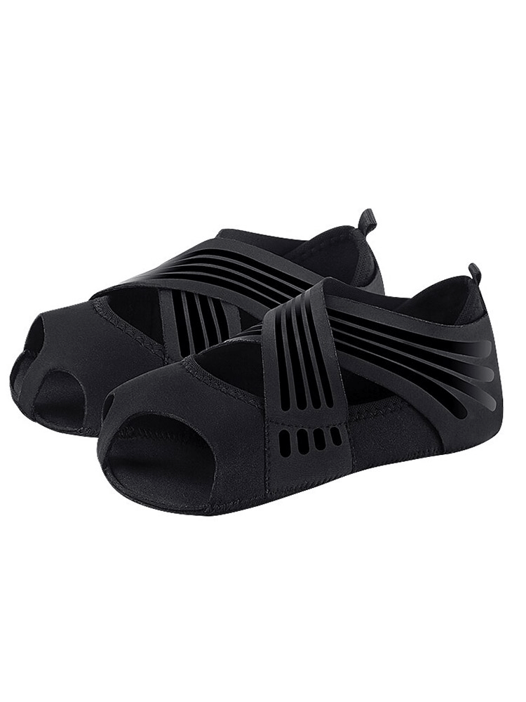 Flat soft anti-slip women's shoe-socks for pilates and yoga, black with open-toe design, secure fit for stability and comfort.
