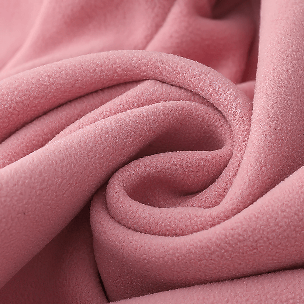 Close-up of soft pink fleece fabric from Fleece Female Hooded Jacket with Zipper Closure - SF4105, highlighting warmth and texture.