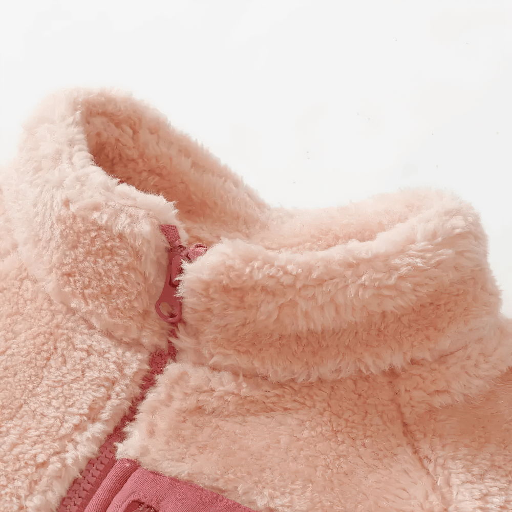 Close-up of cozy fleece jacket with zip pocket and soft texture - SF3827, showcasing plush fabric and contrasting zip detail.