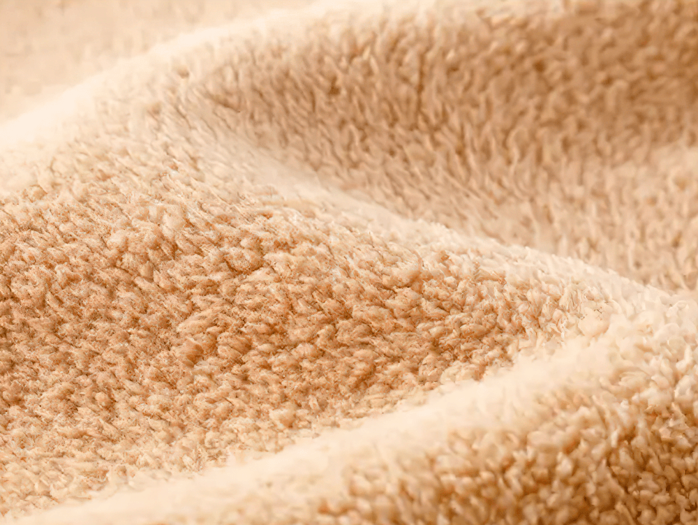 Close-up of soft fleece lining from the Fleece Lined Zipper Hoodie with Pockets - SF3667, showcasing plush texture for warmth and comfort.