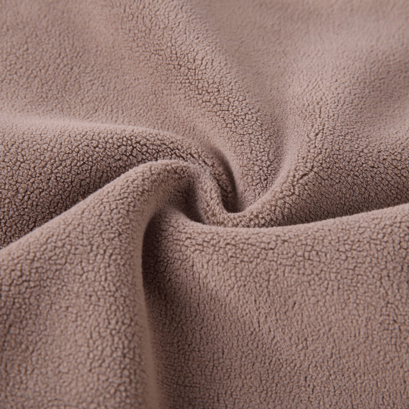 Close-up of brown fleece fabric texture, ideal for men's thermal underwear offering warmth and comfort in cold weather.
