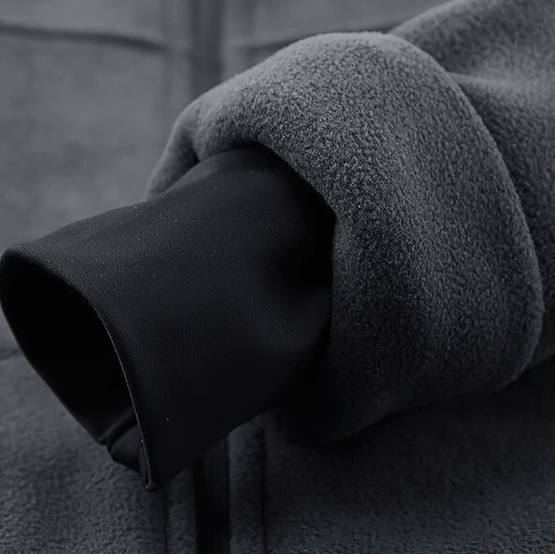 Close-up of grey fleece jacket sleeve detail showing ribbed cuff, highlighting the warm cashmere lining. Perfect for cold weather.