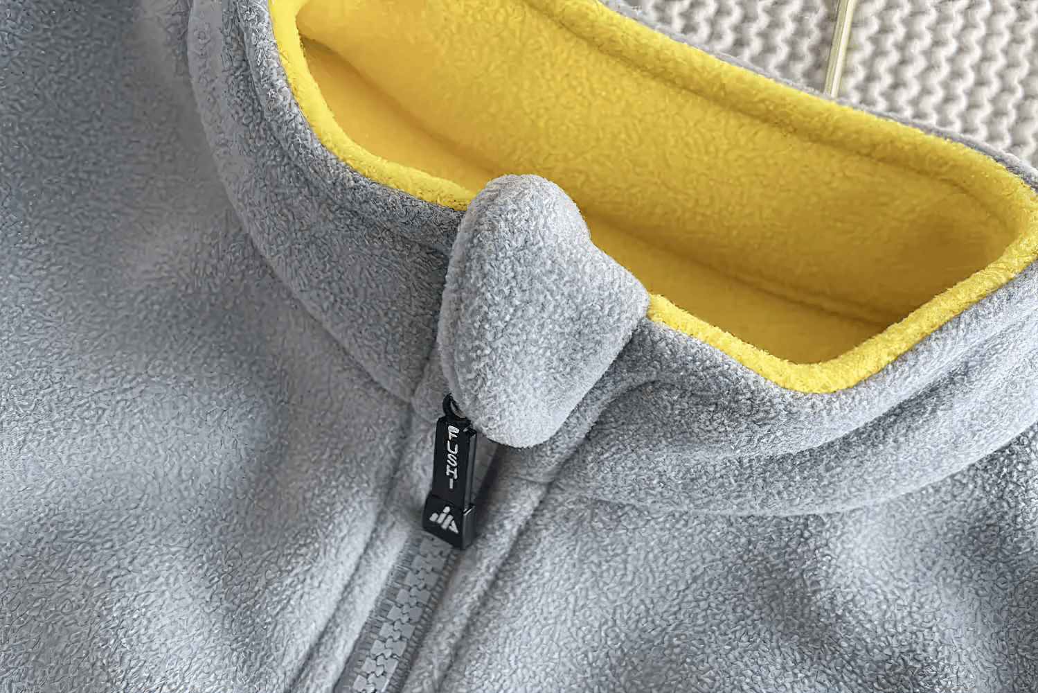 Close-up of Fleece Zip Jacket with Lion Embroidery Design - SF3541 showing soft inner lining and high collar.