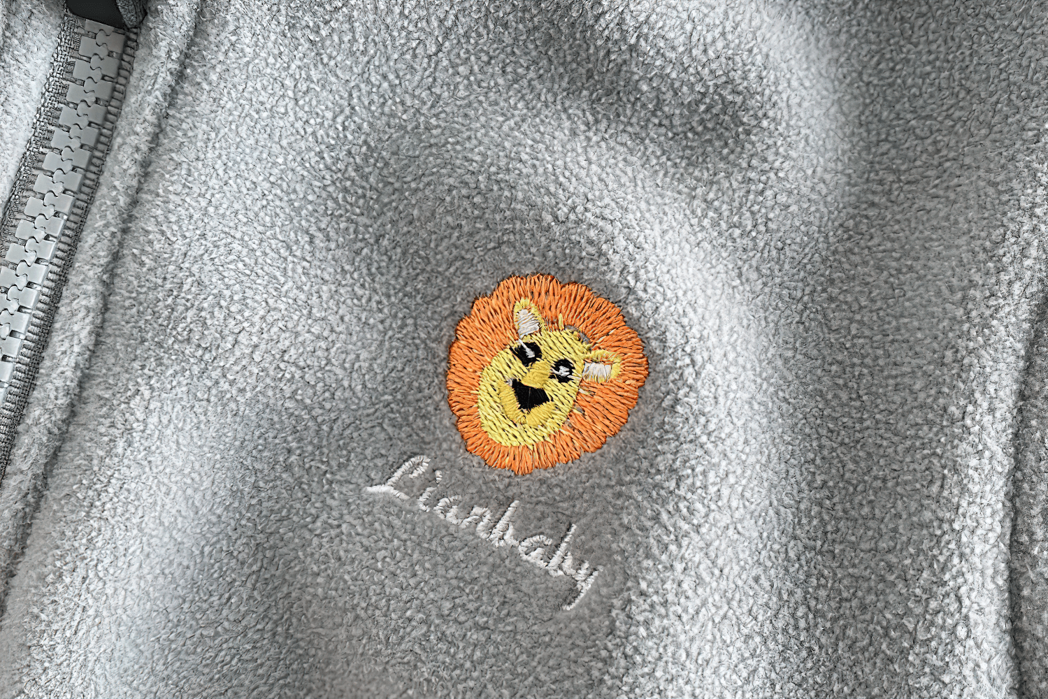 Fleece Zip Jacket with Lion Embroidery Design - SF3541 close-up showing cute lion detail on warm polar fleece kids jacket.