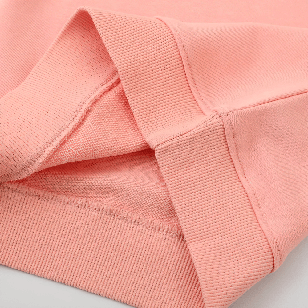 Close-up of Floral Embroidered Sweatshirt With Raglan Sleeves - SF3634, showing ribbed cuffs and hem in a soft, pink fabric.