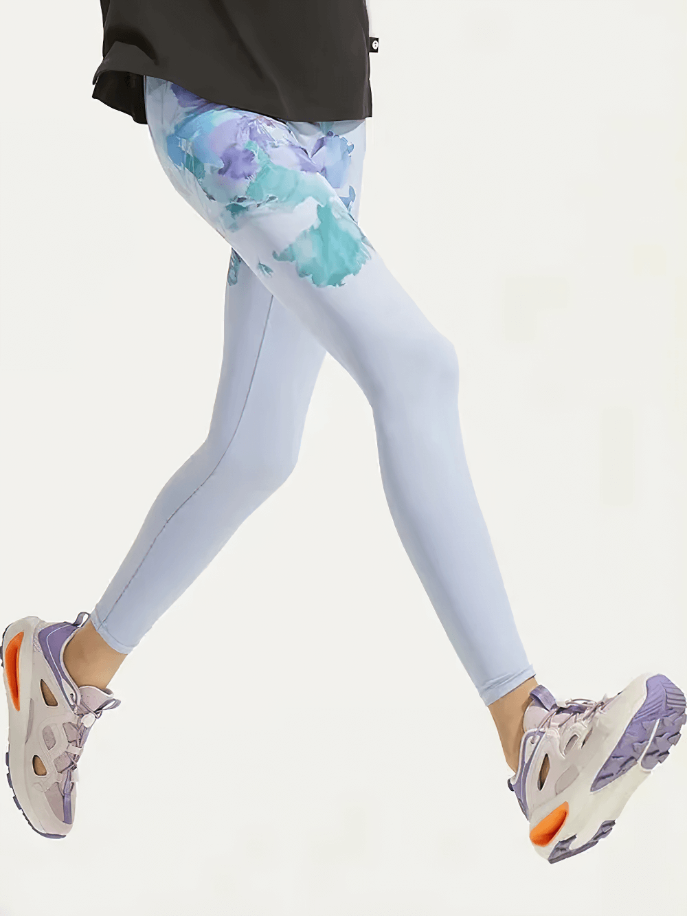 Girl wearing Floral Print Girls Yoga Leggings with High Waist - SF3819, leaping in style with breathable spandex material.