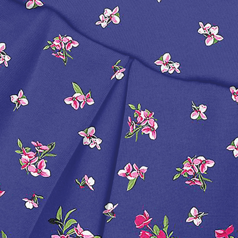 Alt Tag: Floral Tennis Skort with Inner Shorts for Women - SF4394 in blue floral print, pleated wrap-style athletic golf skirt fabric close-up