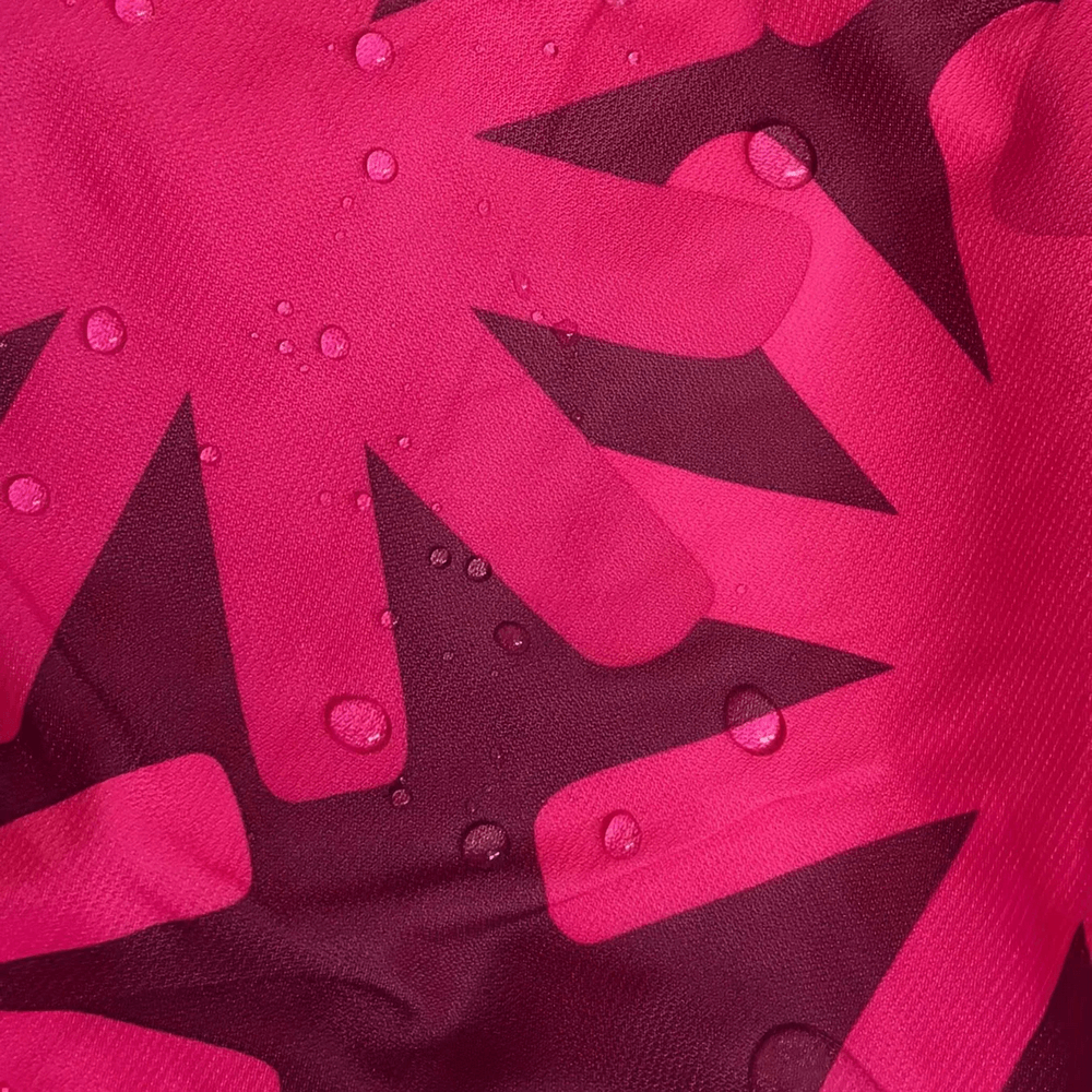 Close-up of Flower Print Windbreaker Jacket with Fleece Lining - SF3587, featuring vibrant flower design and water droplets on fabric.