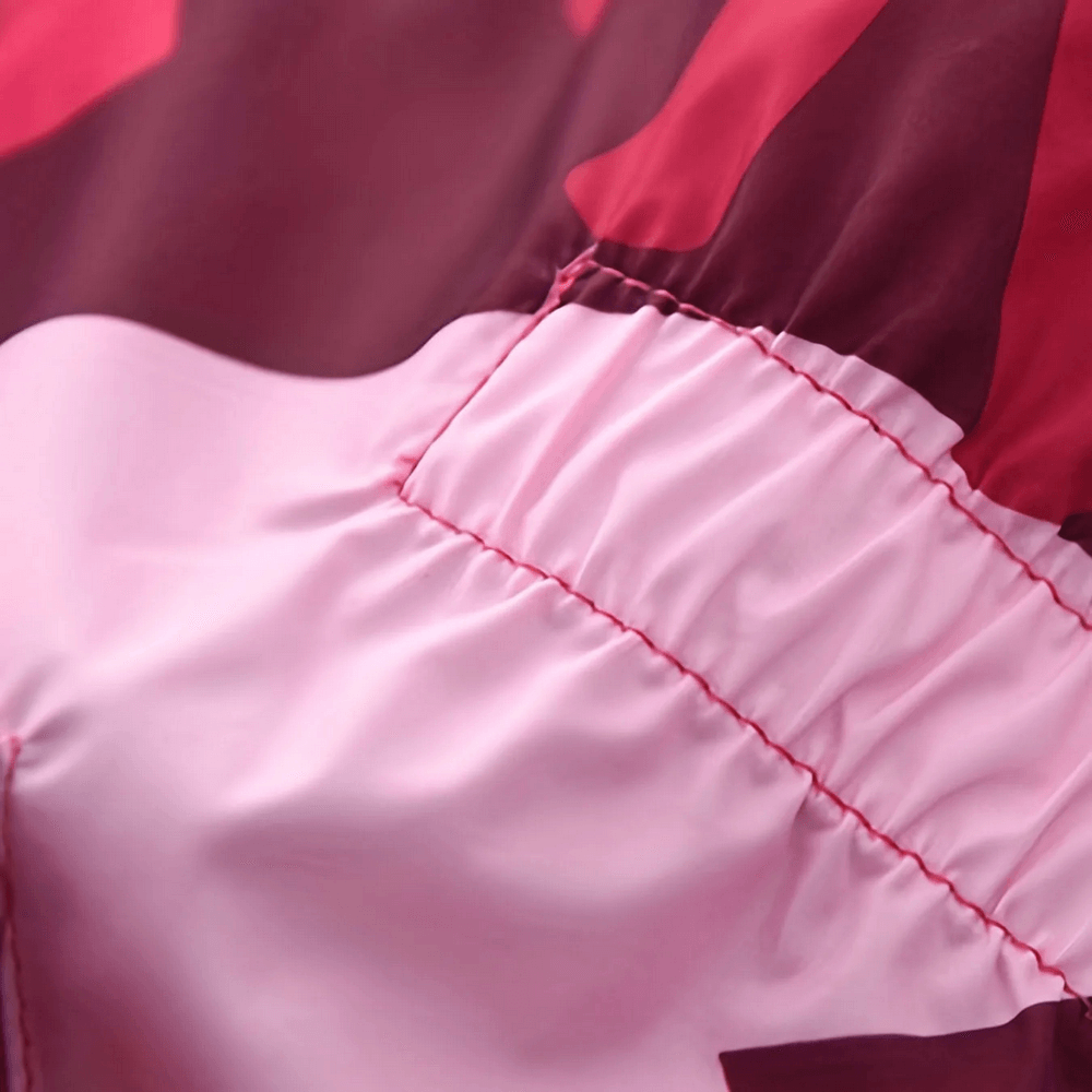 Close-up of Flower Print Windbreaker Jacket with Fleece Lining - SF3587, showing pink floral design and detailed stitching.