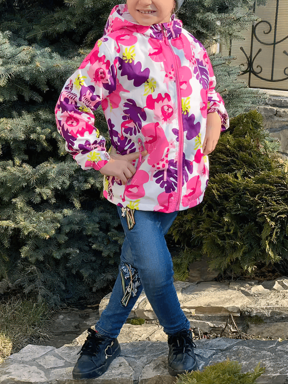 Girl wearing Flower Printed Windbreaker Jacket with Polar Fleece - SF3588, standing outdoors with floral pattern showcased.