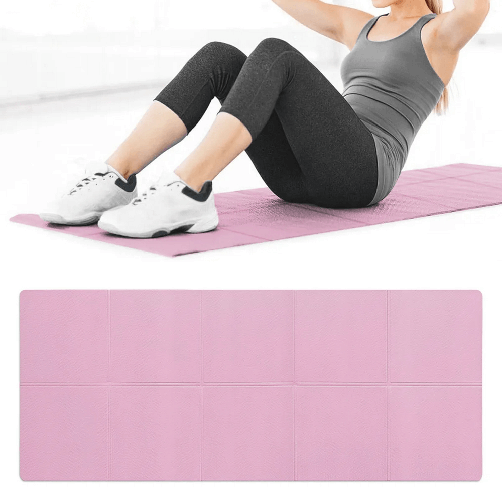 Woman using a pink foldable non-slip yoga mat for exercise, showcasing its portability and grip for safe workouts.