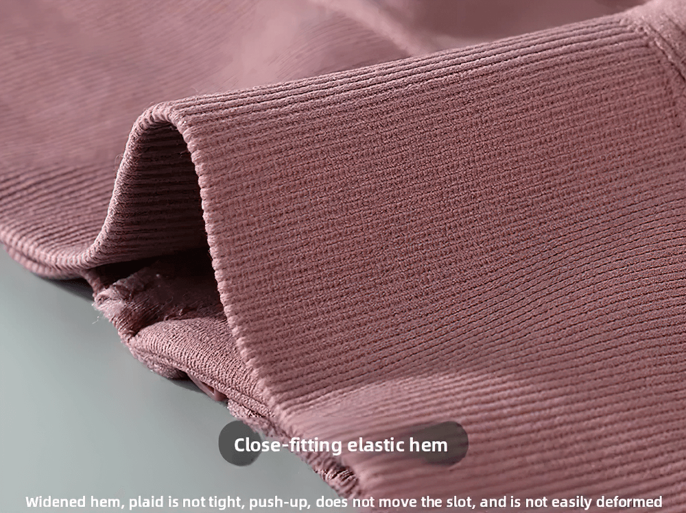 Close-up of the Front Zip Crossback Sports Bra with Push Up Pads - SF4004 elastic hem, showing stretch fabric for a comfortable fit.